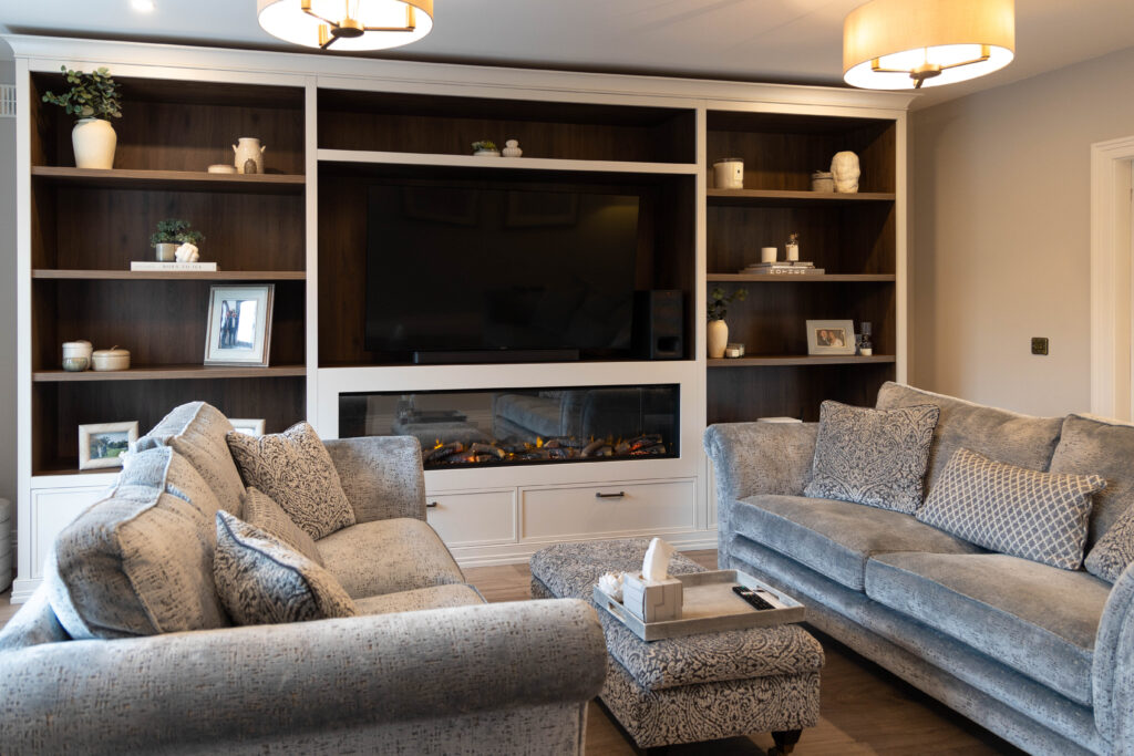 Media unit with bespoke shelves & a fireplace