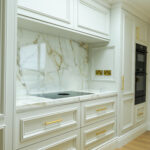 Modern kitchen renovation with bespoke cabinetry, ceramic sink, and Quooker tap by Dovetail Interiors