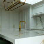 Modern kitchen renovation with bespoke cabinetry, ceramic sink, and Quooker tap by Dovetail Interiors