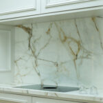 Modern kitchen renovation with bespoke cabinetry, ceramic sink, and Quooker tap by Dovetail Interiors