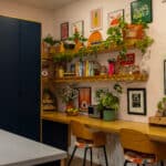 blue wadrobe & wooden desk and floating shelves