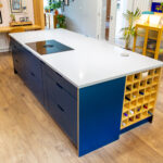 Blue Kitchen island with Bora hob & Bespoke wine rack.